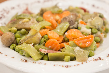 ..Photos.Dish with Mix of cooked vegetables on wooden table. Diet and healthy food concept. Vegetarian food