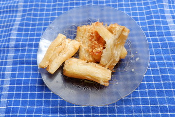 fried cassava with a sprinkling of cheese on top