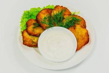 Potato pancakes with sour cream and dill