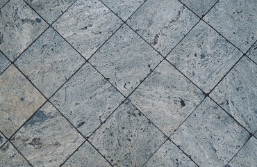 Stone pattern on tile floor with grid line for background.