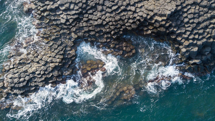 Vietnam natural landscape. Stock image of Ganh Da Dia reef in Phu Yen, Vietnam with special stones, rock make great terrain. Aerial view, top view of Ganh Da Dia sea with amazing basalt causeway shape