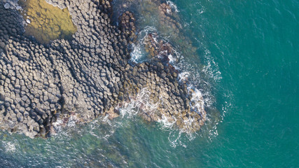 Vietnam natural landscape. Stock image of Ganh Da Dia reef in Phu Yen, Vietnam with special stones, rock make great terrain. Aerial view, top view of Ganh Da Dia sea with amazing basalt causeway shape