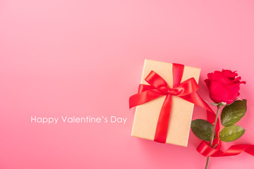 Kraft Gift box with beautful red ribbon and rose, concept of Valentine's, anniversary, mother's day and birthday greeting, copy space, top view.