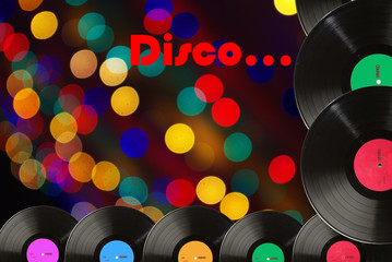 Disco.LP discs on a color light background