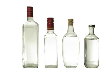 Vodka and gin in bottles. Isolated on white