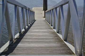 Close up view of pier with direction going down