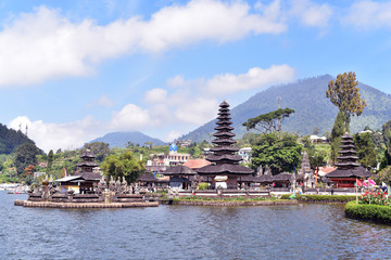 Tourists visiting Pura Ulun Danu Bratan temple in Bali island, Indonesia