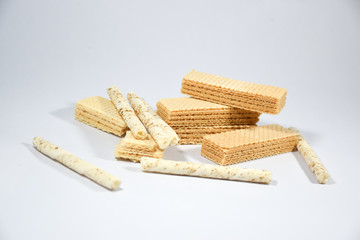Wafer stick Stuffed with vanilla cream and milk on a white background