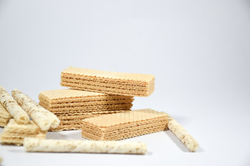 Wafer stick Stuffed with vanilla cream and milk on a white background