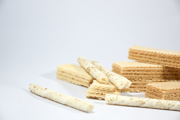 Wafer stick Stuffed with vanilla cream and milk on a white background