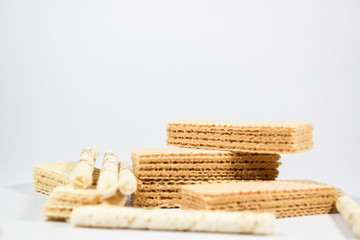 Wafer stick Stuffed with vanilla cream and milk on a white background