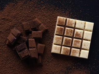 Different beautiful chocolate on a black background.