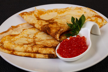 Pancake with red caviar