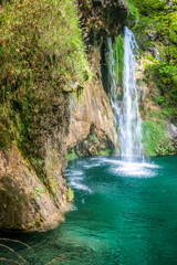 Obraz na płótnie Canvas Waterfall at a turquoise lake. The Plitvice Lakes National Park, Croatia, Europe.