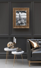 Luxury interior of a black and metallic gold living room with black and white pictures, copper skull, side tables, sofa, cushions and ethnic sculptures.  3D rendering illustration