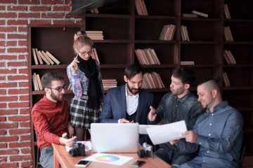 team of designers discussing a new advertising project.