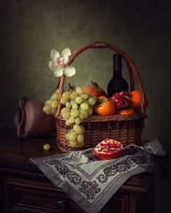 Still life with orchid flower and fruits