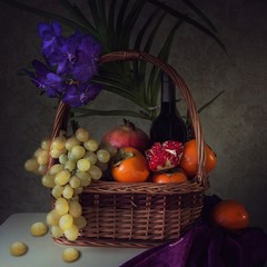 Still life with orchid flower and fruits
