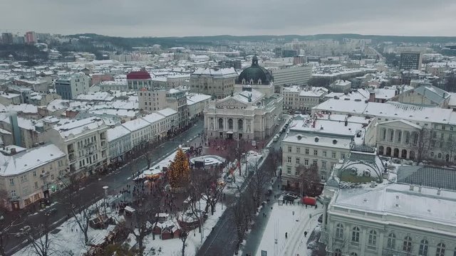 Lviv, Ukraine - 25, December 2018. Arial shot. Opera house. Christmas tree. Christmas Fair. People are walking around the city center