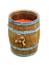 Fototapeta premium Oak Barrel. Open wooden barrel filled with milled hot pepper. Isolated on white background