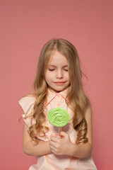 small girl in hand holds a sweet cupcake cake candy