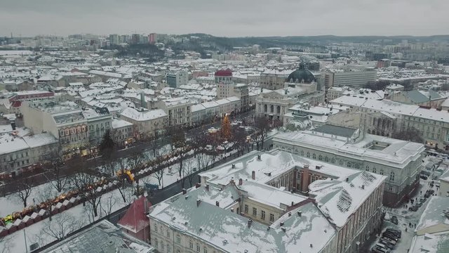 Lviv, Ukraine - 25, December 2018. Arial shot. Opera house. Christmas tree. Christmas Fair. People are walking around the city center