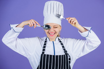 Traditional culinary. Professional cook of culinary school. Culinary arts academy. Culinary school concept. Woman professional chef hold utensil spoon fork having fun. Time to eat. Appetite and taste