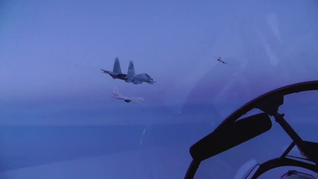 Two bombers and a fighter in a turn