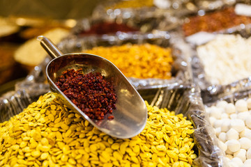 A scoop of dried barberries in a spice shop in Dubai, United Arab Emirates