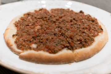 Manakeesh, a savoury flatbread that is popular across the Levant and the Middle East, topped with minced lamb