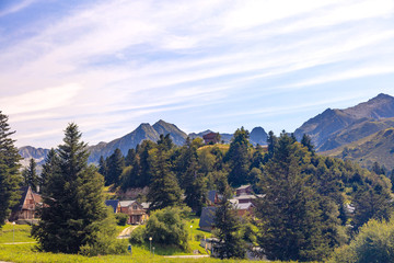 View of chalets at the ski resort Guzet-snow in summer. Couserans-Pyrenees, Ustou Valley, Ariège, Occitanie, France.