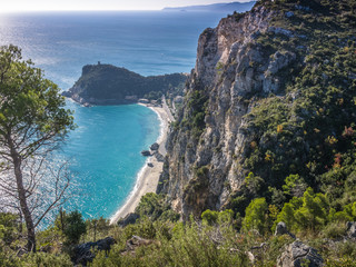 Beautiful aerial view of Baia dei Saraceni with blue Mediterranean sea and a stone watchtower near Varigotti, quaint fisherman village near Finale Ligure, Savona, Liguria, Italy, Italian Riviera