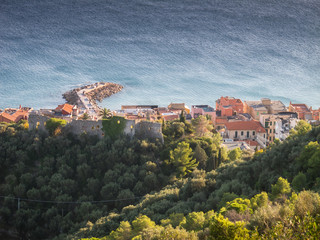 Beautiful sunset aerial view of old town (Borgo Vecchio) and stone jetty of Varigotti, quaint fisherman village near Finale Ligure, Savona, Italy, Italian Riviera