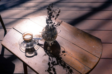 Eucalyptus and coffee on the wood table