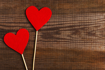 Red hearts on a wooden table. Blank or greeting card background for Valentine's Day. Place for...
