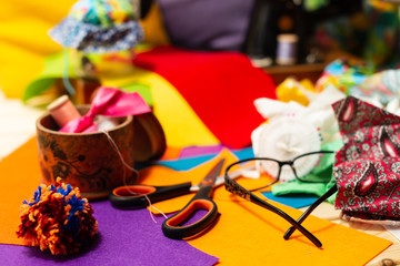 Sewing on a sewing machine design. Making objects with your own hands. Multicolored threads and fabrics. Hobby. Retro.