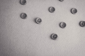 Beautiful black and white texture with a lot of round buttons for sewing, needlework. Copy space. Flat lay. The background
