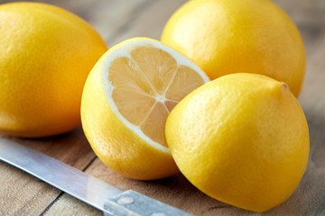 Close up of fresh ripe lemons on table