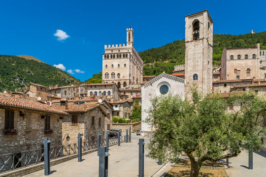 Scenic sight in Gubbio with Palazzo dei Consoli and the Church of Giovanni Battista, medieval town in the Province of Perugia, Umbria, central Italy.