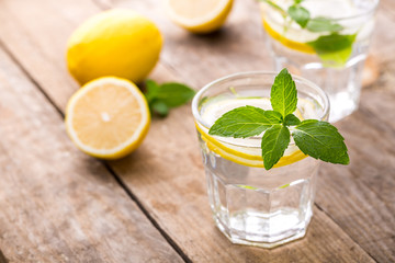 Fresh Lemonade in a Glasses with Lemon Slices and mint