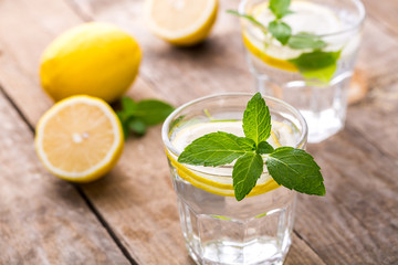 Fresh Lemonade in a Glasses with Lemon Slices and mint