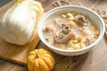 trotter soup with wooden background