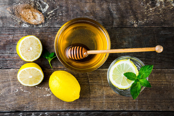 Top view of detox water with honey, lemon and mint, Health and Organic.