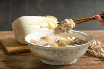 trotter soup with wooden background