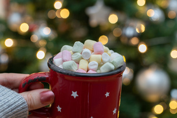 Woman hands holding a cup of coffee