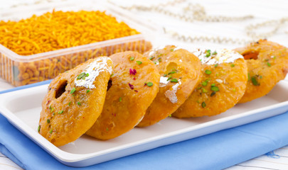 Indian Traditional Sweet Kachori Also Know As Mawa Kachori, Kachauri or Kachodi, Stuffed Kachori With Condensed Milk, Cheese and Dry Fruits And Served With Sugar Syrup