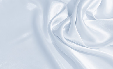 The texture of the satin fabric of blue color for the background