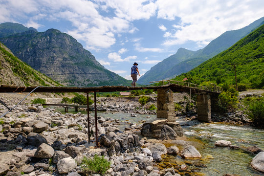 Albania, Shkoder County, Albanian Alps, Cem Canyon, hiker on bridge over Cem river