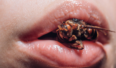woman with healthy skin. honey lifting. bee milk Royal jelly eco product. girl with bee. tightening of facial skin facelift. Halloween masquerade party. Beauty fashion girl with bee on lips