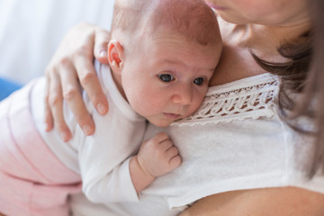 happy mother with her baby girl at home. Lifestyle indoors and family love concept